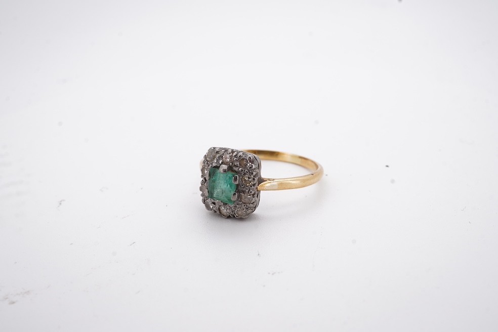 An early to mid 20th century yellow metal, emerald and diamond set rectangular cluster ring, size R, gross weight 3.5 grams. Condition - poor to fair